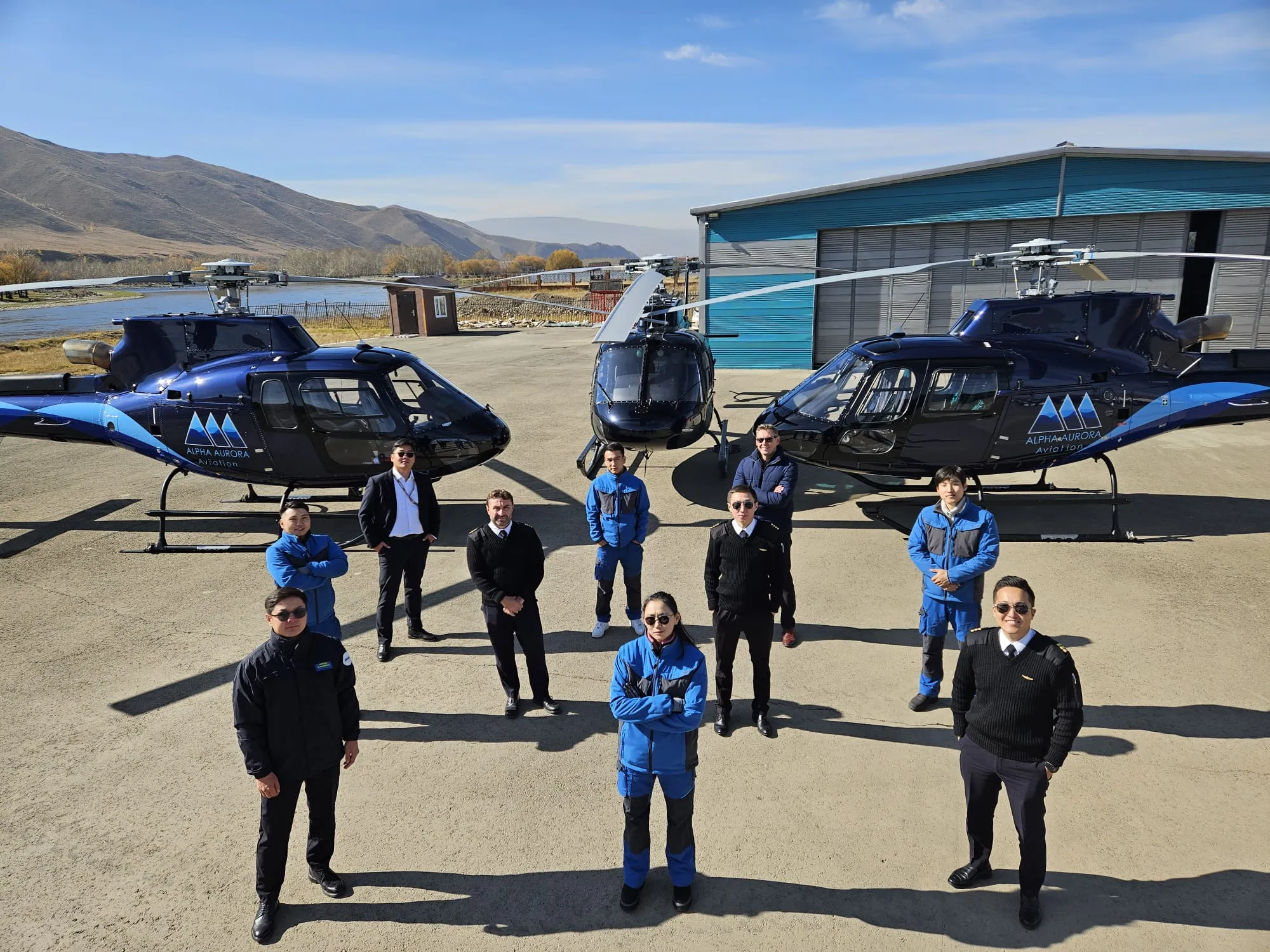Alpha Aurora Aviation team with the fleet at the hangar